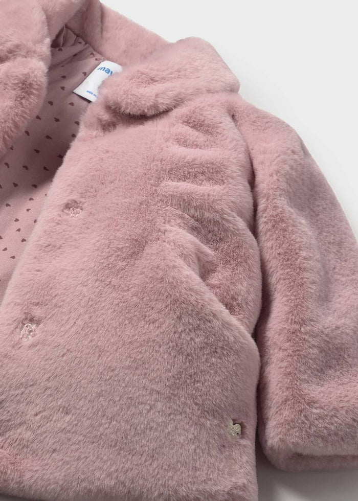 Closeup of Mayoral baby faux fur coat showing plush recycled polyester texture and sleeve detail.