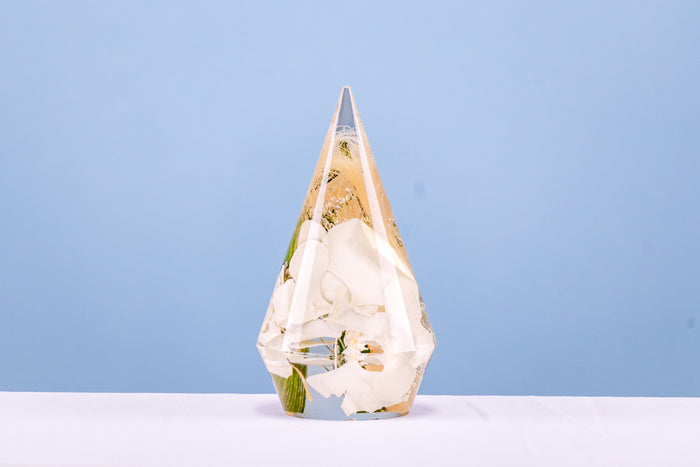 Landscape photo of a pressed flower large ring holder displayed on a styled counter