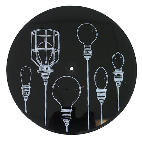A black circular item from Dryjackets Lights Locks & Faucets collection features white line drawings of six uniquely designed light bulbs arranged vertically across its surface.