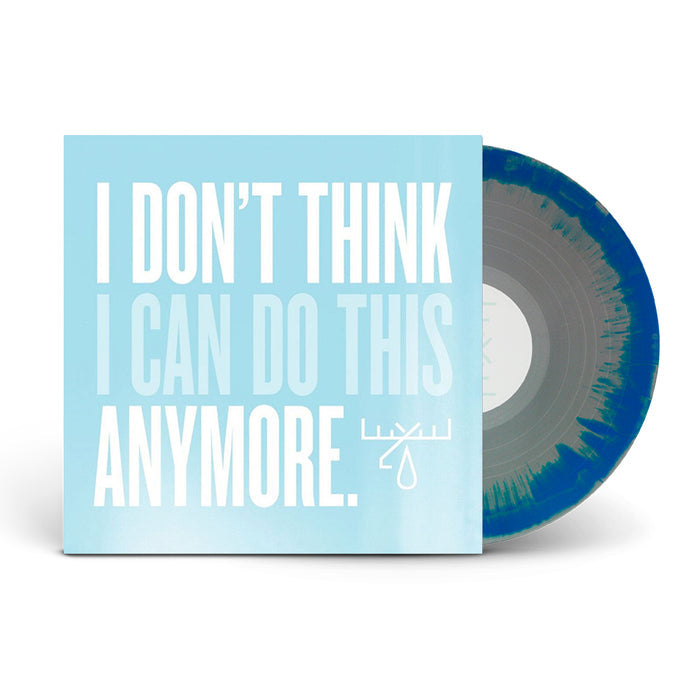 A blue and gray vinyl record by Moose Blood is partially in a light blue sleeve with bold white text, hinting at emotional album tracks. A small abstract logo appears near the bottom right of this vinyl record.