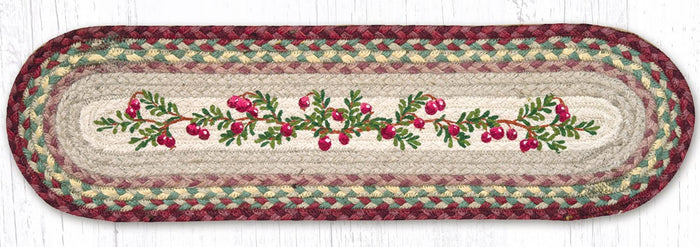 Stair tread with cranberry and leaf design with red, green, and tan braided jute.