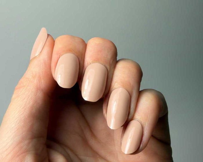 Coffee Cream UV-Free gel nail wraps worn on the hand, close-up