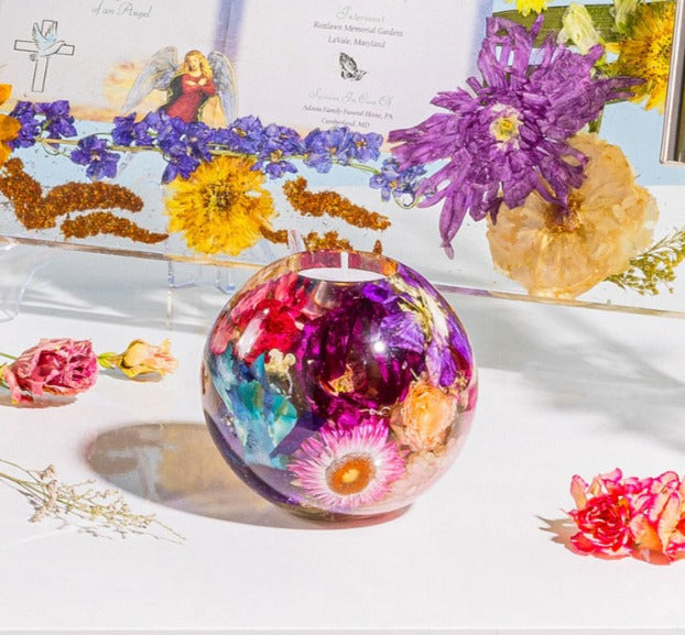 Small square product photo of a pressed flower candle sphere with a tealight inside