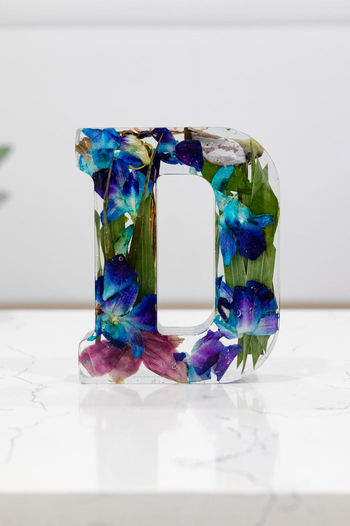 Tall portrait photo of a pressed flower 6-inch letter block with vibrant mixed dried flowers