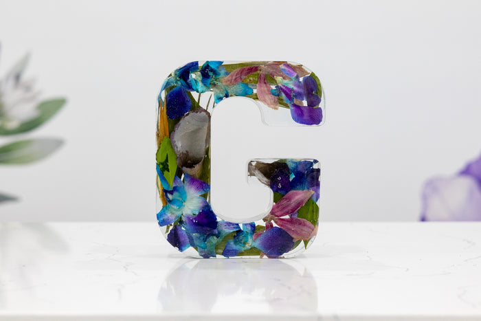 Landscape photo of a pressed flower 6-inch letter block on a neutral background