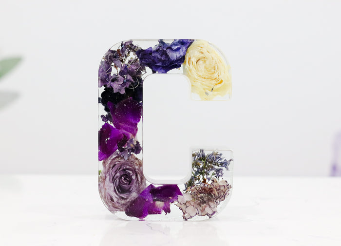 Landscape photo of a pressed flower 6-inch letter block on a kitchen countertop tablescape