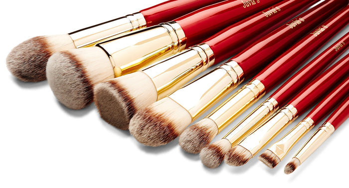 Foundation Brush, Flat Top Brush, Round Top Brush, Tapered Brush, Big Blending Brush, Flat Shader Brush, Blending Brush, Precision Pointy Brush, Flat Brow Brush, on their sides