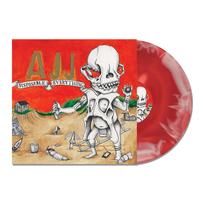 A red and white vinyl record from AJJ partially slides out of its cover, which features surreal artwork of a skeletal figure with exposed organs and extra limbs in a trash-filled desert landscape.