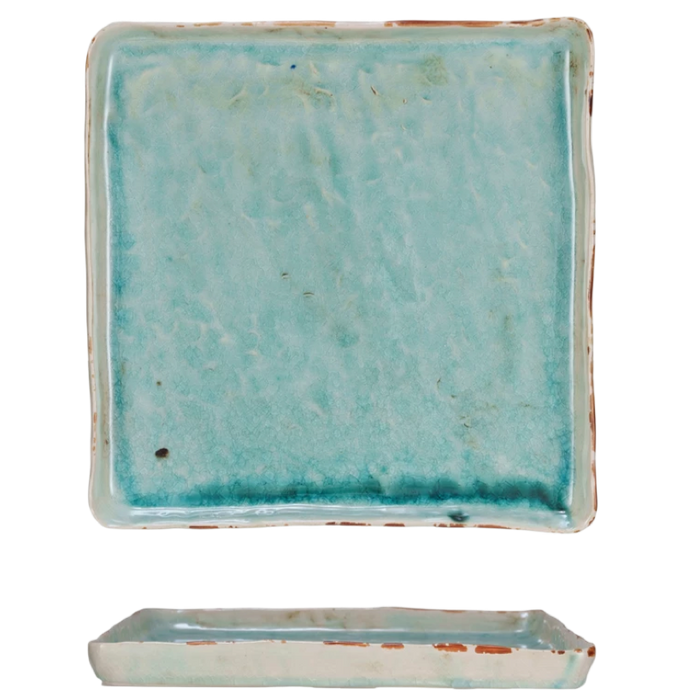 Turquoise square tile with a matching rectangular base on a white background