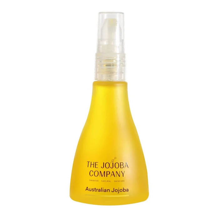 Yellow bottle with a clear spray nozzle labeled 'The Jojoba Company Australian Jojoba' on a white background