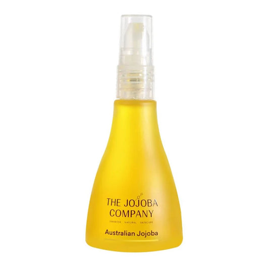 Yellow bottle with a clear spray nozzle labeled 'The Jojoba Company Australian Jojoba' on a white background