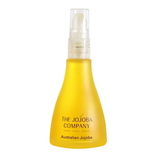 Yellow bottle with a spray mechanism labeled 'The Jojoba Company Australian Jojoba' on a white background
