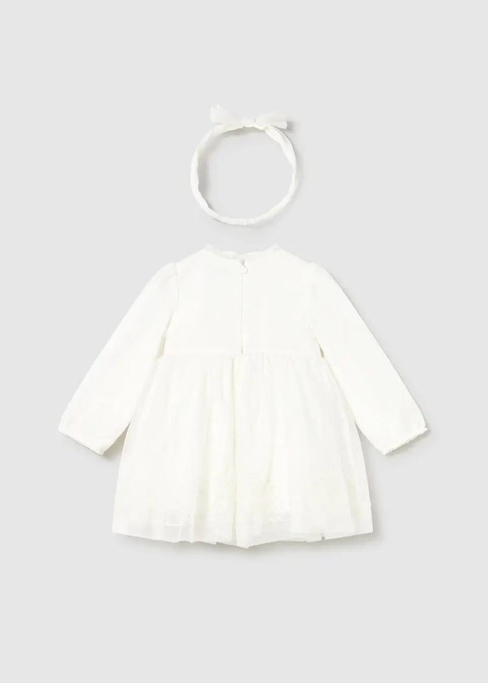 Back view of Mayoral baby girl tulle dress showing invisible zipper, gathered skirt, and Ivory headband.