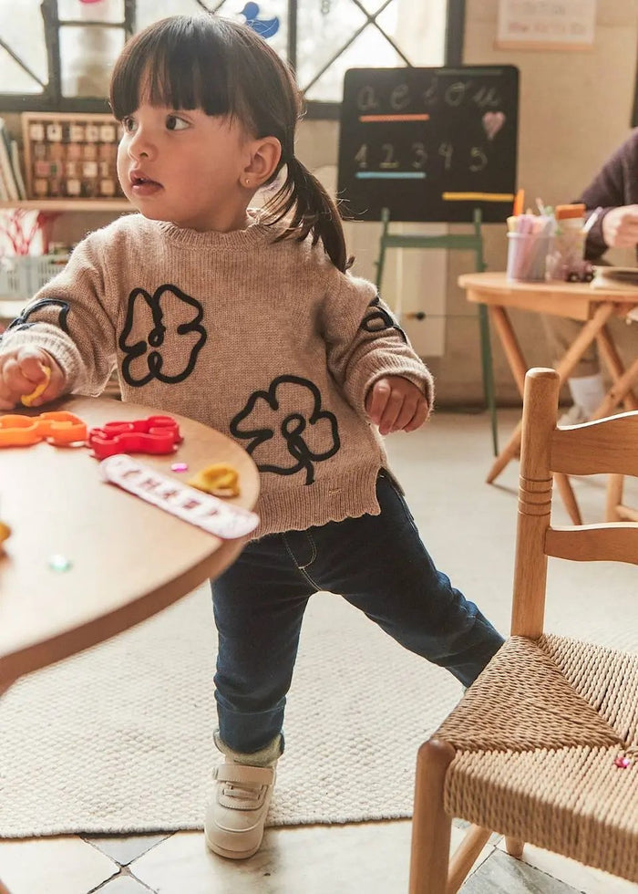 Toddler wearing Mayoral baby girl skinny jeans for a comfortable everyday outfit.