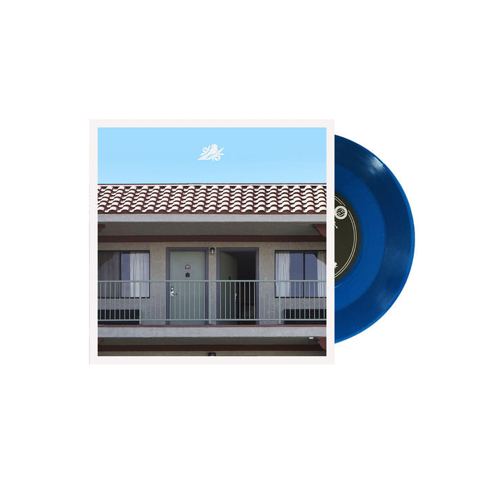 7" Album cover for Bayside "Vacancy" on a white background. Album cover shows the side of a hotel building with a single room. Bayside logo above. Vinyl is Transparent blue