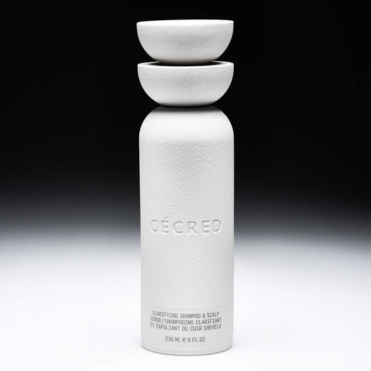 Cécred Clarifying Shampoo & Scalp Scrub 236ml bottle with dual bowl cap displayed upright against a gradient black-to-white background