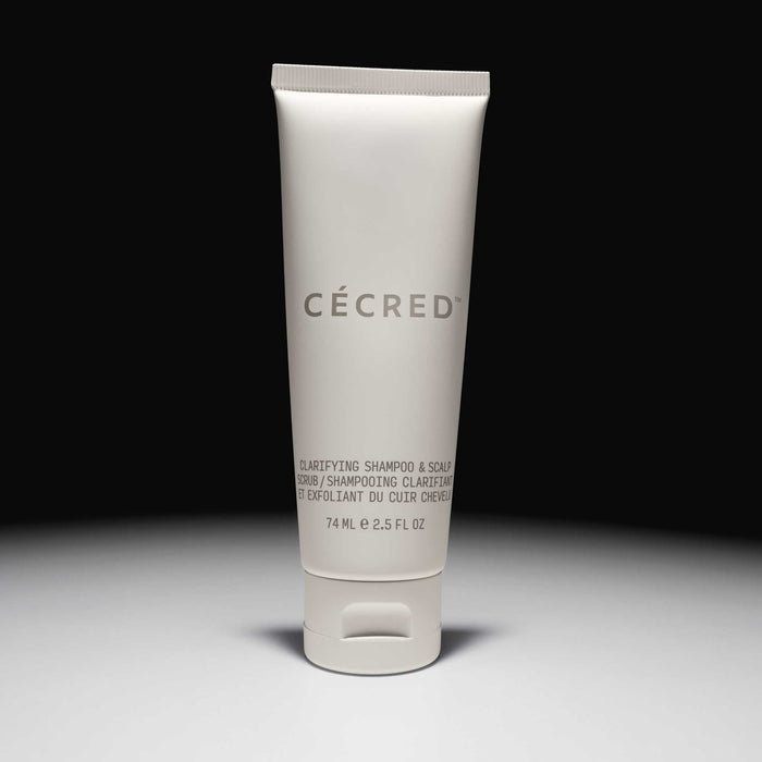 Cécred Clarifying Shampoo & Scalp Scrub travel size 74ml tube displayed upright against a gradient grey background