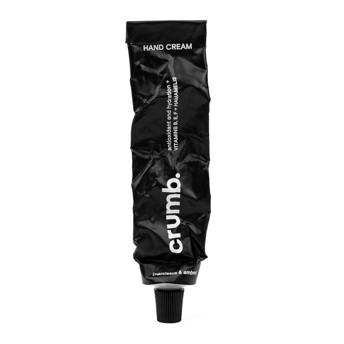 Black tube of crumn hand cream nercissus & ambra on a white background