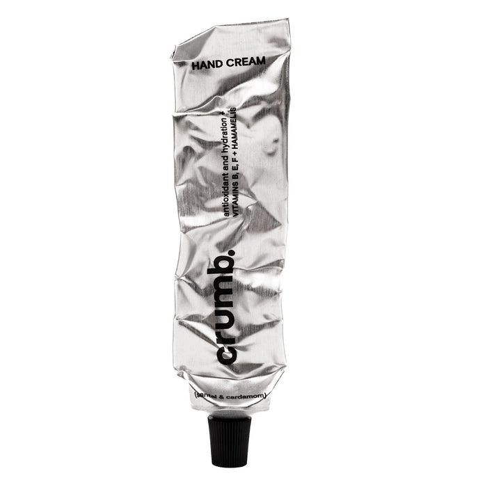 crumb silver tube of hand cream santal & cardamon on a white background