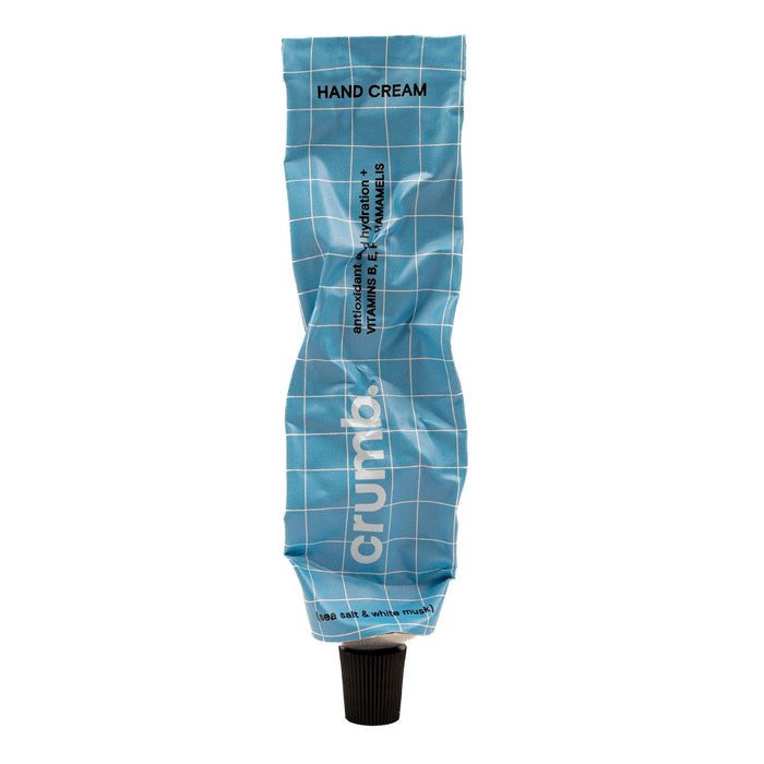 crumb blue tube of hand cream sea salt & white musk on a white background