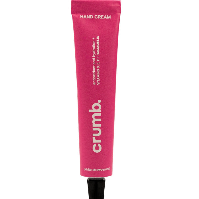 Crumb pink hand cream white strawberries tube on a white background