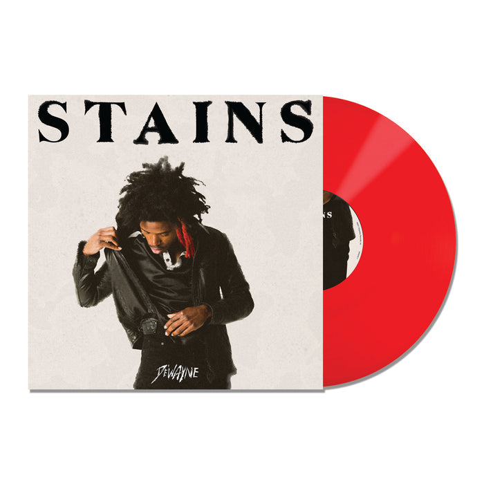 Vinyl Album cover on a white background. Album cover has black text "STAINS" at the top. Image of De'Wayne below. Vinyl is Red.
