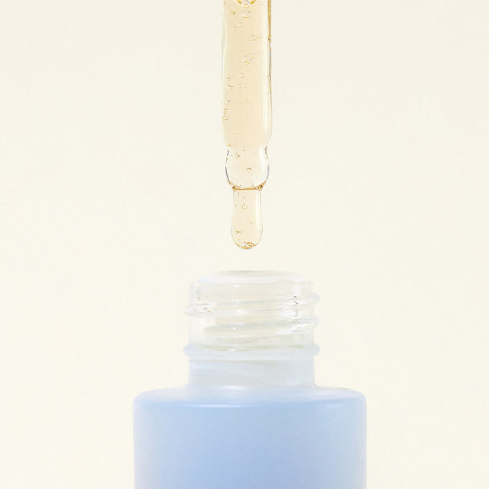 Open dropper bottle of certified organic Hyaluronic Hydration Complex, showing the texture.
