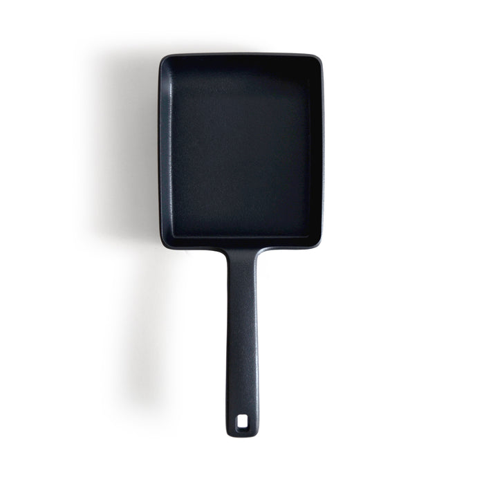 Cast Iron omelet pan by OIgen on a white background
