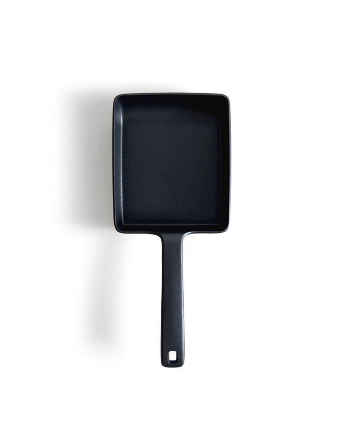 Cast Iron omelet pan by OIgen on a white background