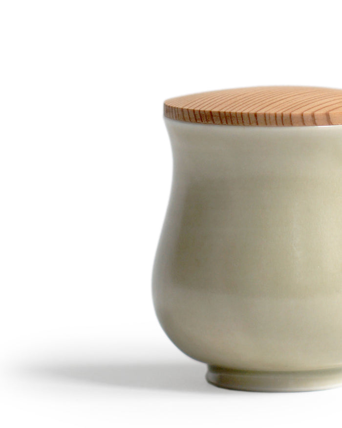 Detail of Cedar Lidded Gourd Teacup by Simplicity silhouetted against white background