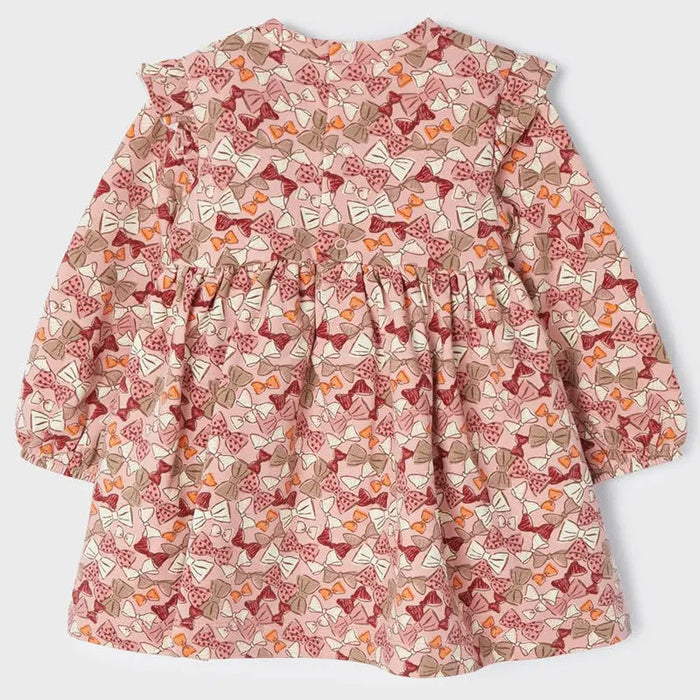 Front view of Mayoral baby girl printed dress showing long sleeves, gathered shape, and allover Rubor pattern.