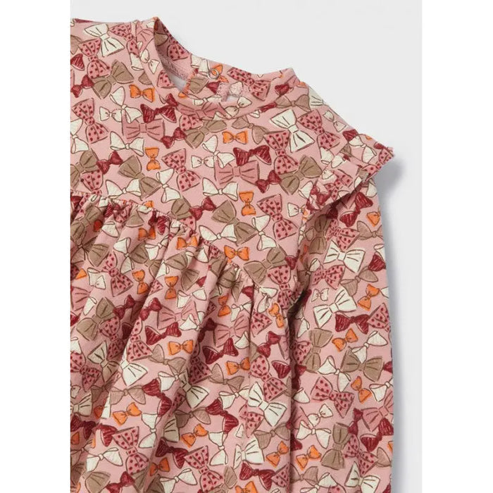 Close-up of Mayoral baby girl Rubor dress showing printed fabric, neckline, sleeve, and gathered detail.