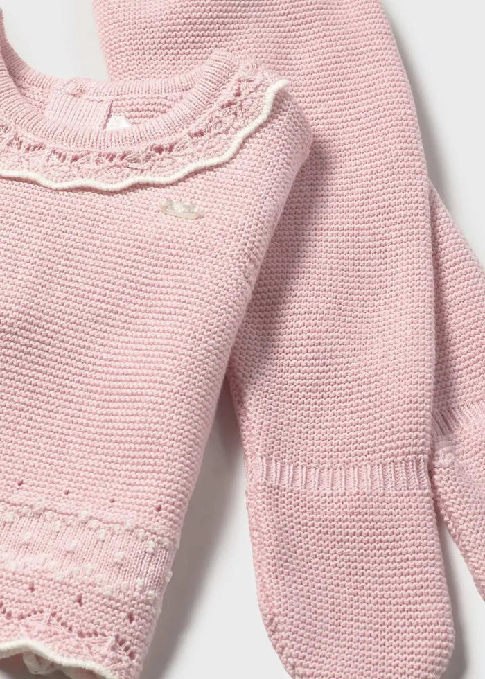 Closeup of Mayoral Pink knit sweater showing soft texture, neckline detail, and buttons.