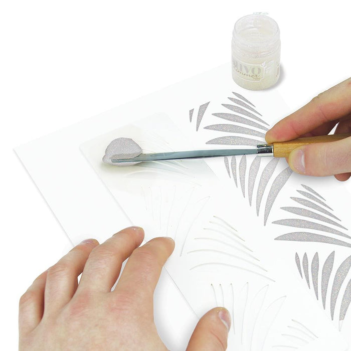 Nuvo - Glimmer Paste - 1.7 oz. Nuvo Glimmer Paste can provide unique variety to your work. Use in combination with any stencil to create dimensional strip designs or bring texture and sparkle to larger areas and projects. The high concentration of glitter is sure to add a vibrant shimmer to whatever you are creating.  Available at Embellish Away located in Bowmanville Ontario Canada. Moonstone example