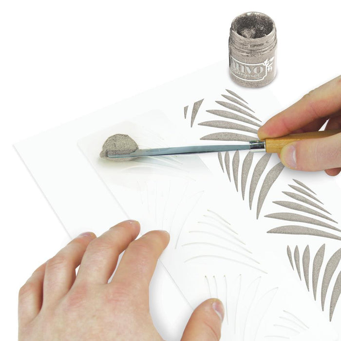 Nuvo - Glimmer Paste - 1.7 oz. Nuvo Glimmer Paste can provide unique variety to your work. Use in combination with any stencil to create dimensional strip designs or bring texture and sparkle to larger areas and projects. The high concentration of glitter is sure to add a vibrant shimmer to whatever you are creating.  Available at Embellish Away located in Bowmanville Ontario Canada. Shooting Stars example.