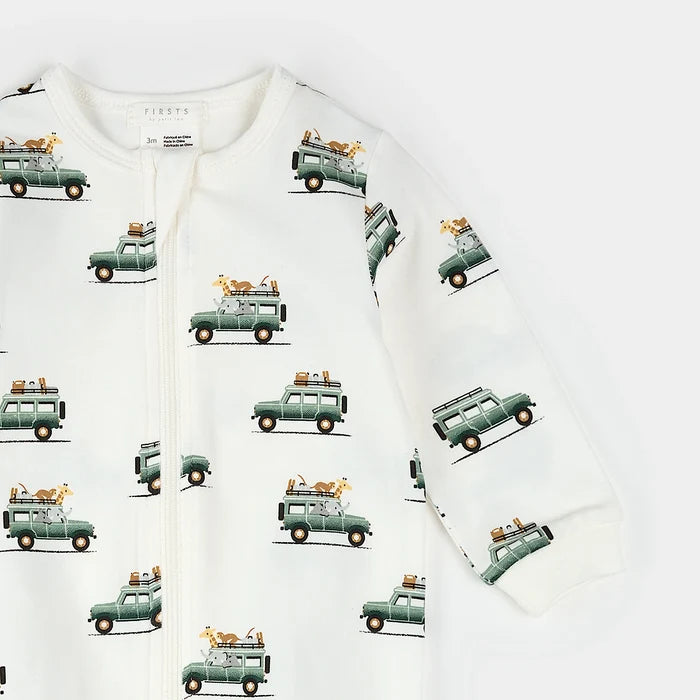 Infant wearing safari jeep print footed sleeper with two-way zipper