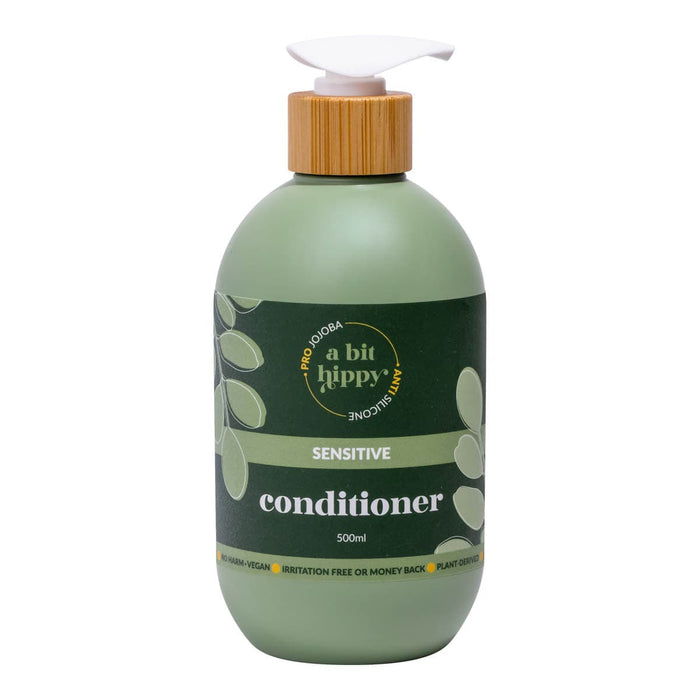 Front of 500ml bottle of anti-irritation conditioner in a green bottle with bamboo lid and pump top.