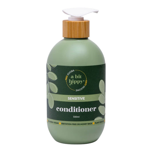 Front of 500ml bottle of anti-irritation conditioner in a green bottle with bamboo lid and pump top.