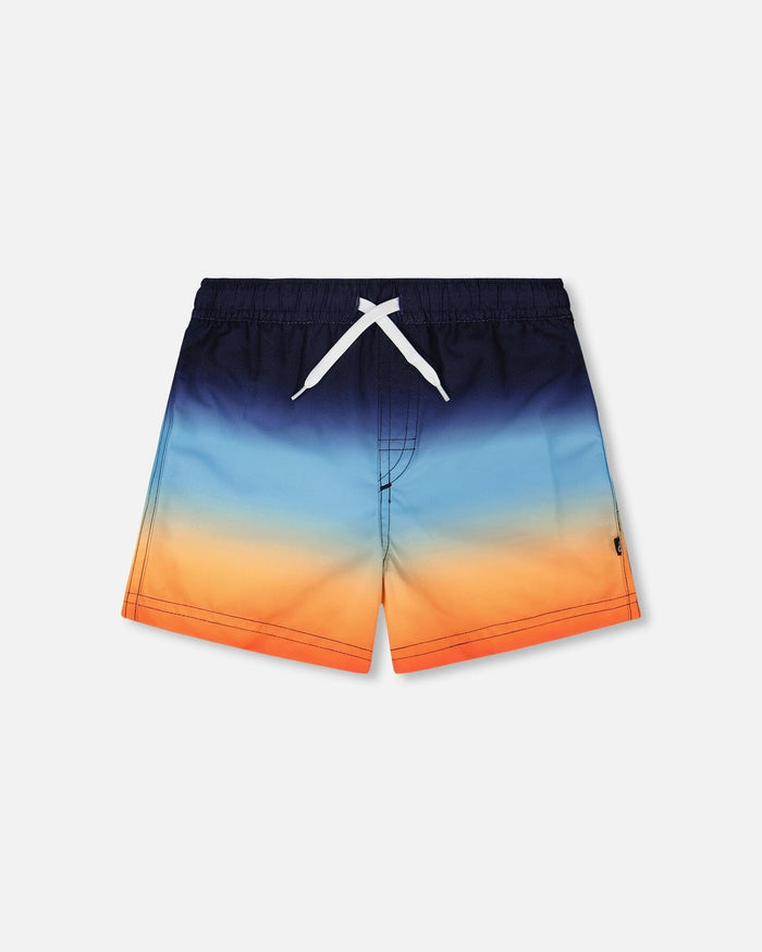 Front flat lay of Deux par Deux boy blue and orange gradient boys swim trunks