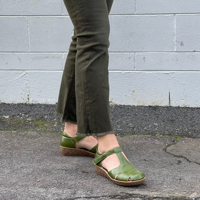 Smart green sandal in soft leather uppers. Velcro strap, wedge sole unit with enclosed heel and enclosed toe. Comfortable T-bar style women's sandal. Women's shoes with cushioned footbed.