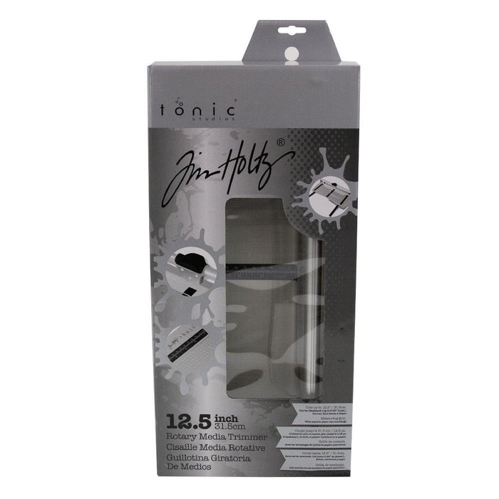 Tim Holtz - Rotary Media Trimmer. Featuring a geared rotary cutting blade, this trimmer effortlessly cuts through a range of crafting mediums. Available at Embellish Away located in Bowmanville Ontario Canada.