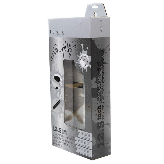 Tim Holtz - Rotary Media Trimmer. Featuring a geared rotary cutting blade, this trimmer effortlessly cuts through a range of crafting mediums. Available at Embellish Away located in Bowmanville Ontario Canada.
