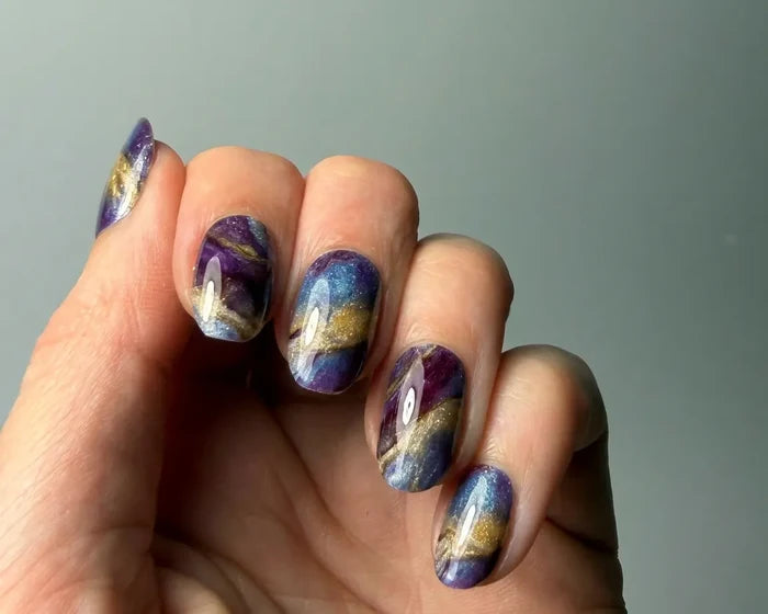 Marble Mood UV-Free gel nail wraps worn on the hand