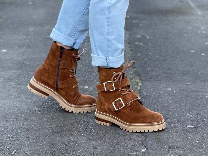 Fashionable work boot style European ankle boot. Comfortable women's boots hand made in Spain from quality suede leather, zipper and lace-up with buckle detail. Chunky rubber sole with a tan upper.