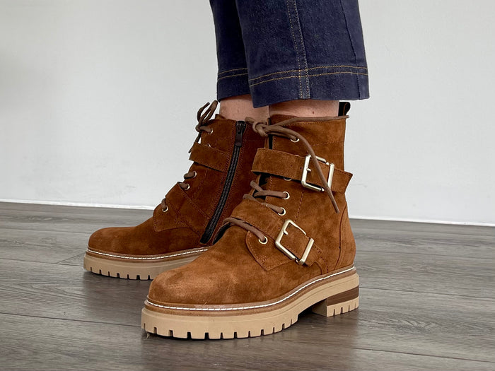 Fashionable work boot style European ankle boot. Comfortable women's boots hand made in Spain from quality suede leather, zipper and lace-up with buckle detail. Chunky rubber sole with a tan upper.